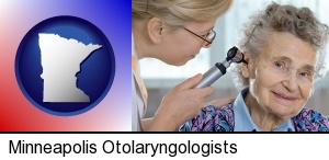 a otolaryngologist examining the ear of a patient in Minneapolis, MN