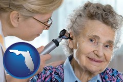 fl map icon and a otolaryngologist examining the ear of a patient