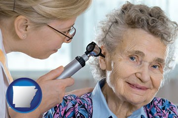 a otolaryngologist examining the ear of a patient - with Arkansas icon