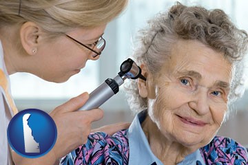 a otolaryngologist examining the ear of a patient - with Delaware icon