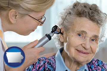 a otolaryngologist examining the ear of a patient - with Iowa icon