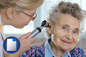 a otolaryngologist examining the ear of a patient - with Utah icon