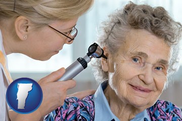 a otolaryngologist examining the ear of a patient - with Vermont icon